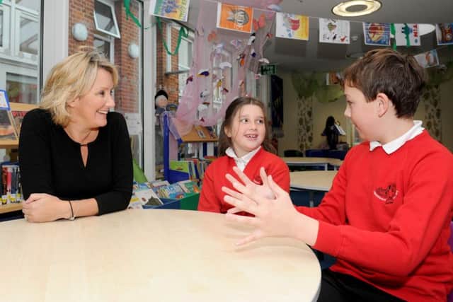 Caroline Dinenage MP talks to Layla Smith (7) and Callum Foster (11). Picture: Sarah Standing