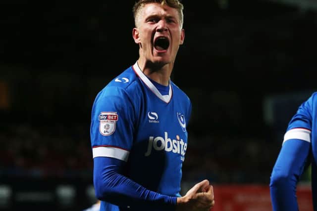 Michael Smith celebrates his first league goal of the season against Cheltenham on Saturday Picture: Joe Pepler