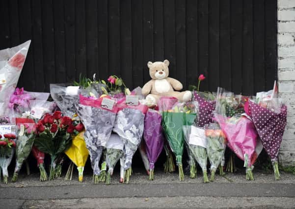 Flowers placed by mourners after the deaths of Jasmine Allsop and Olivia Lewry in Gosport in 2013