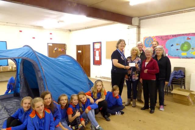 Members of the RCA donating more than £500 to the 2nd Rowlands Castle Girl Guides for tents