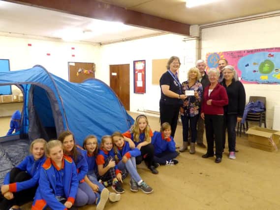 Members of the RCA donating more than Â£500 to the 2nd Rowlands Castle Girl Guides for tents