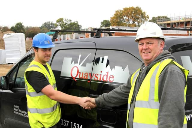 Apprentice Thomas Talman shakes hands with his new employer, Tony Slack, from Quayside