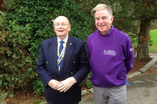 Fareham Rotary Club president Norman Chapman, left, with Tim Seward from Canine Partners