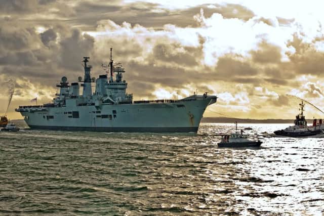 HMS Illustrious returning to Portsmouth in 2014 Picture: Shaun Roster