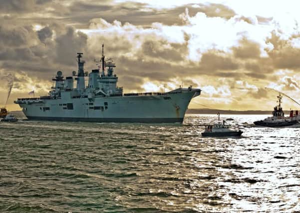 HMS Illustrious returning to Portsmouth in 2014 Picture: Shaun Roster
