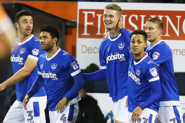 Enda Stevens, left, and Pompey celebrate Michael Smith's goal. Picture: Joe Pepler