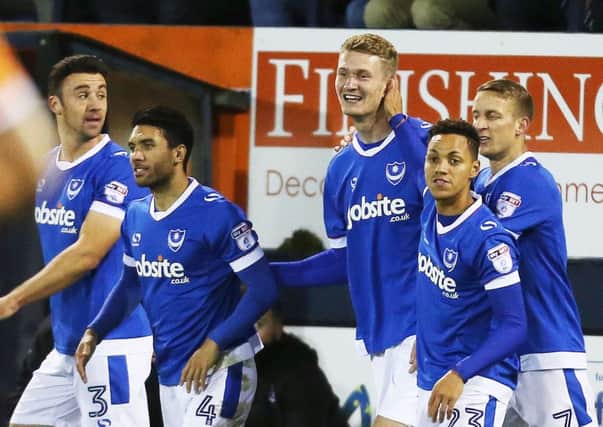 Enda Stevens, left, and Pompey celebrate Michael Smith's goal. Picture: Joe Pepler