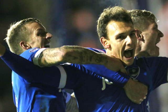 Kal Naismith is mobbed after scoring Pompey's third goal against Luton. Picture: Joe Pepler