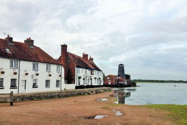 Robert Pragnells winning photo of Langstone. Left, Robert with Sophie Thomas from M&S