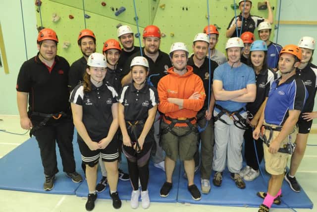 Members of Fareham Round Table take on rock climbing at St Vincent College as part of a socialisation programme
