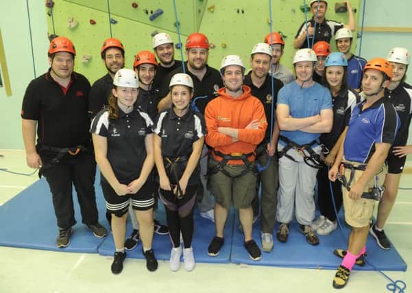Members of Fareham Round Table take on rock climbing at St Vincent College as part of a socialisation programme