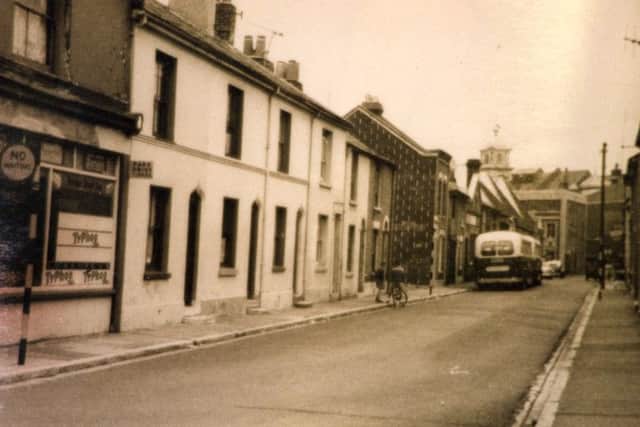 Triggs  store and looking down St Vincent Street. The bus is parked outside the  boys club.
