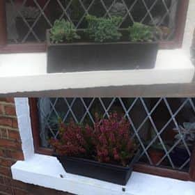 The 'stolen' window box (top) and the cheaper plastic version (bottom)