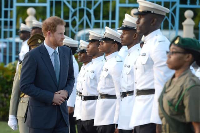 Prince Harry inspects a Guard of Honour on his arrival at Pointe Seraphine near Castries on the island of St Lucia during the second leg of his Caribbean tour.
Picture: Julian Hamilton/Daily Mirror/PA Wire