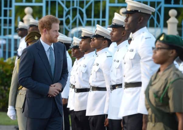 Prince Harry inspects a Guard of Honour on his arrival at Pointe Seraphine near Castries on the island of St Lucia during the second leg of his Caribbean tour.
Picture: Julian Hamilton/Daily Mirror/PA Wire