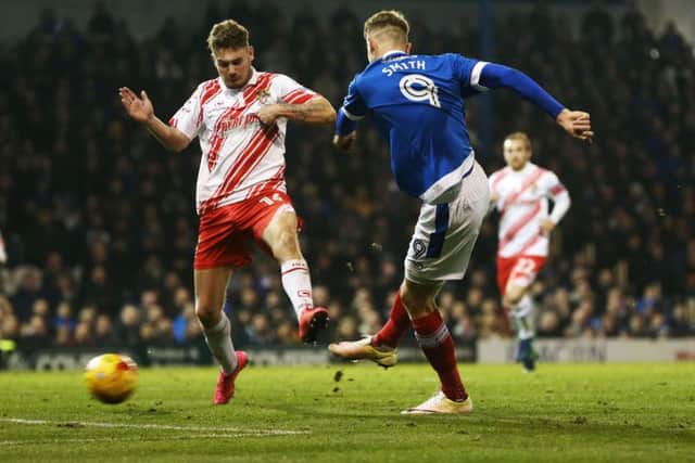 Michael Smith scores in the 2-1 defeat at Fratton Park Picture: Joe Pepler