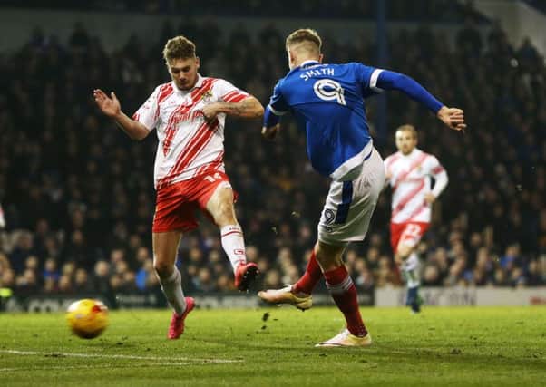 Michael Smith scores in the 2-1 defeat at Fratton Park Picture: Joe Pepler