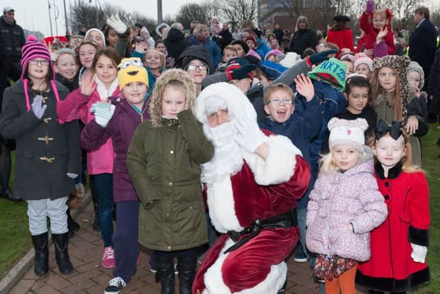 Santa with some of the children St Johns Primary School, Gosport Picture: Keith Woodland