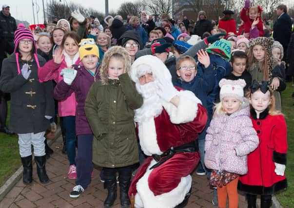 Santa with some of the children St Johns Primary School, Gosport Picture: Keith Woodland