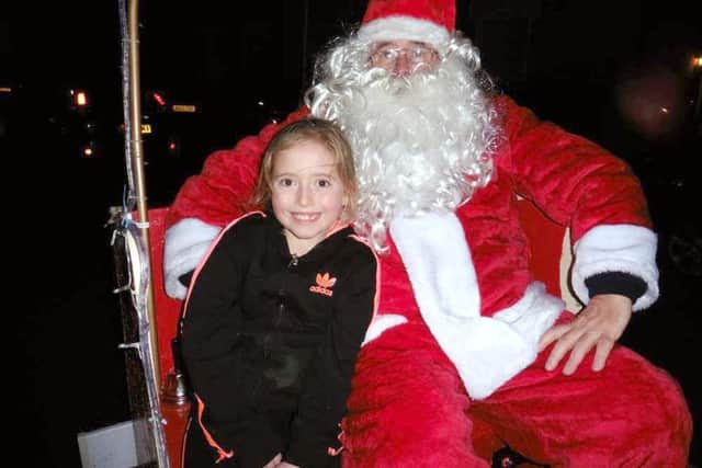 Youngster Dolly-Ana Norrish enjoys last years Santa sleigh run in Gosport