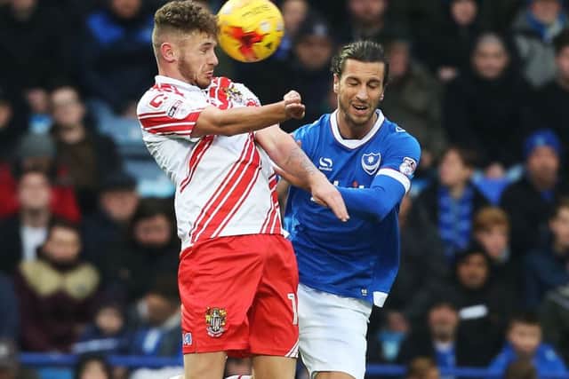 Christian Burgess in action before his substitution at half-time on Saturday Picture: Joe Pepler