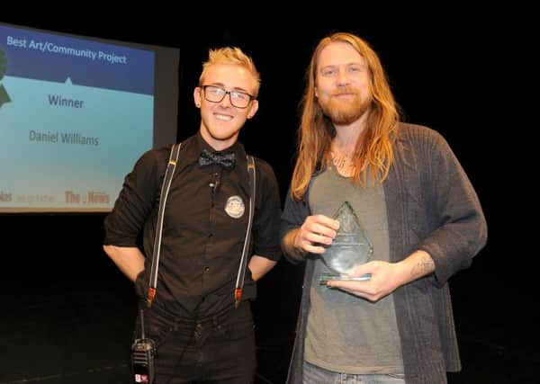 Aled Price, left, from the New Theatre Royal presents the Best Art or Community Project to winner Daniel Williams

Picture: Sarah Standing (161597-3815)