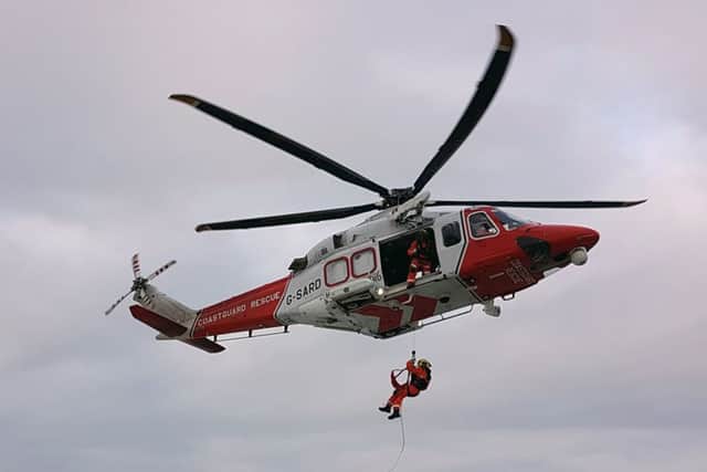 Coastguards winch injured man to safety before flying him to hospital in Southampton