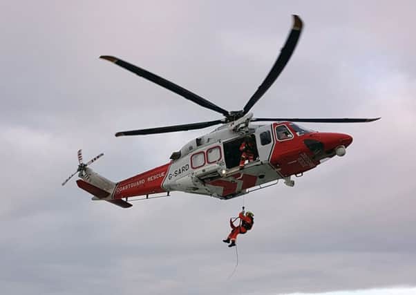 Coastguards winch injured man to safety before flying him to hospital in Southampton