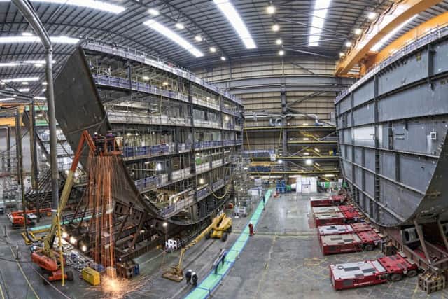 Picture of HMS Prince of Wales, the second of the Royal Navy's Queen Elizabeth Class aircraft carriers, having its F and G ring sections joined together at BAE Systems' shipbuilding bay within Portsmouth Naval Base.