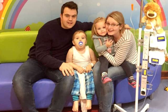 George O'Shaughnessy, three, with his mum Amy, dad Craig and sister Isabella