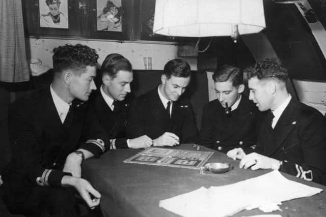 Participants in the uckers tournament at the Royal Navy Submarine Museum