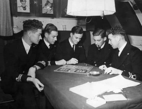 Participants in the uckers tournament at the Royal Navy Submarine Museum