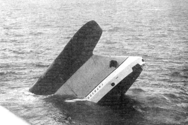 The bow of the Russian factory ship, Gorizont, protrudes from the sea 22 miles south of St Catherine's Point, Isle of Wight