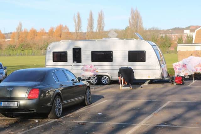 Travellers who have parked up at the tax offices in Cosham have been ordered to leave. Among their vehicles are two Bentleys and several Mercedes Picture: UKNIP