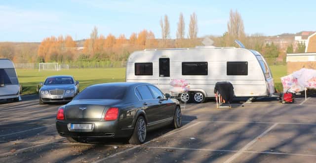 Travellers who have parked up at the tax offices in Cosham have been ordered to leave. Among their vehicles are two Bentleys and several Mercedes Picture: UKNIP