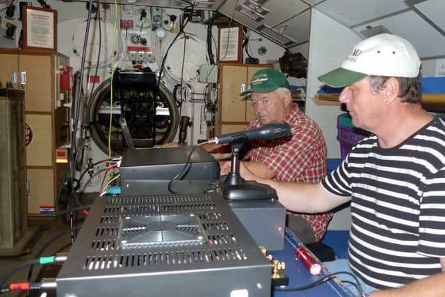 Wir haben Kontakt! German amateur radio hams Mario Kricheldorf (right) and RÃ¼diger Hagemann calling up HMS Collingwood, Fareham