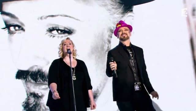 Amba Tremain on stage performing with Boy George