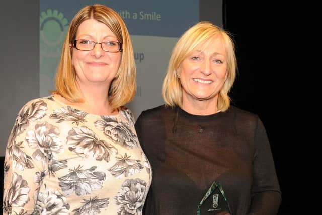 Linzi Stean from Colas (left) presents the runner-up award in Service With A Smile to Jane Hall