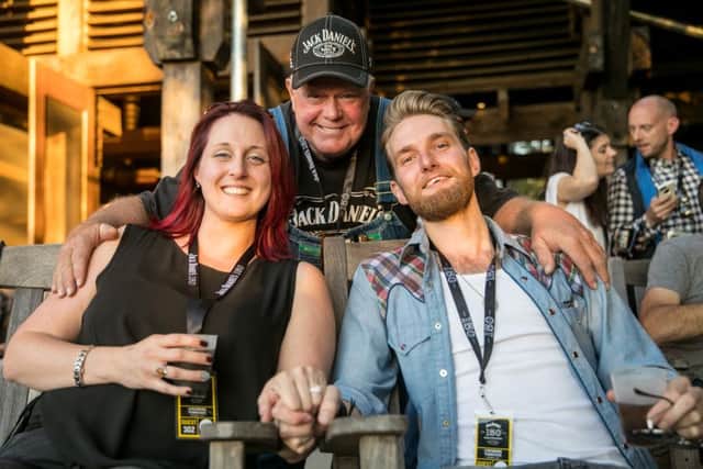 Clare Fountain and Michael Haycock with Jack Daniels assistant Master Distiller, Chris Fletcher (behind) at the Jack Daniels Distillery in Lynchburg, Tennessee, right after Michael proposed.