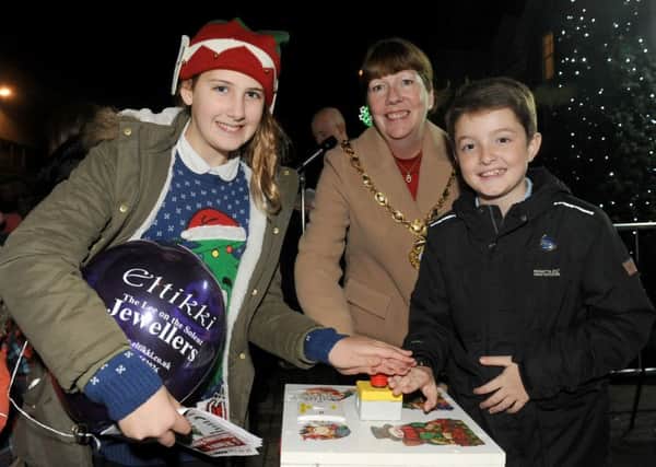 Mayor of Gosport Lynn Hook with head girl Willow McAlister  and head boy Joseph Turner from Lee-on-the-Solent Junior School, turning on the town's Christmas lights 

Picture: Sarah Standing (161614-7807)
