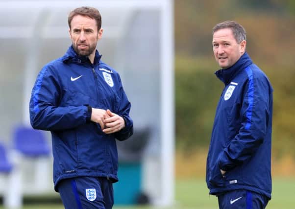 England assistant boss Steve Holland, right, was Gareth Evans youth-team coach at Crewe and chose not to offer him a professional contract
