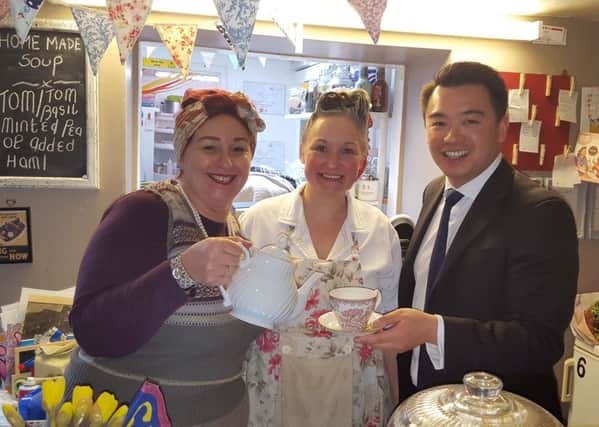 Havant MP Alan Mak at the Fourteas Tea Rooms  with owner Jacqui Unal and staff