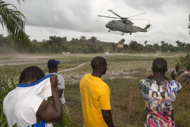 A Merlin helicopter dropping off another load of food for the remote villages off Sierra Leone