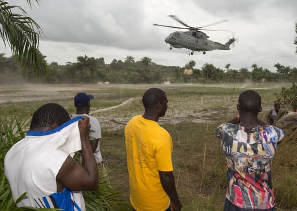 A Merlin helicopter dropping off another load of food for the remote villages off Sierra Leone