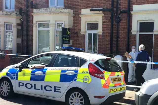 Police investigate the hammer attack in April