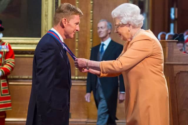 Astronaut Tim Peake is made a Companion of the Order of St Michael and St George by Queen Elizabeth II Picture:: Dominic Lipinski/PA Wire