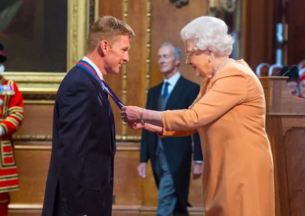 Astronaut Tim Peake is made a Companion of the Order of St Michael and St George by Queen Elizabeth II Picture:: Dominic Lipinski/PA Wire