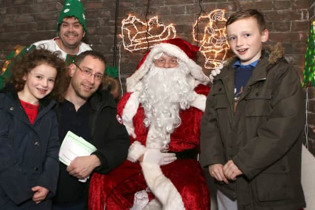 Toby Evans, Isla, Richard Midgley and Kaelum with Santa