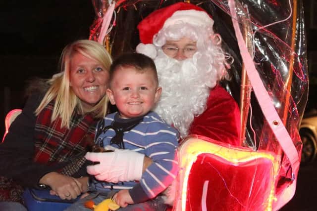 Kelly Harrop-Truscott with  Mason, three,and Santa
Picture: Habibur Rahman
