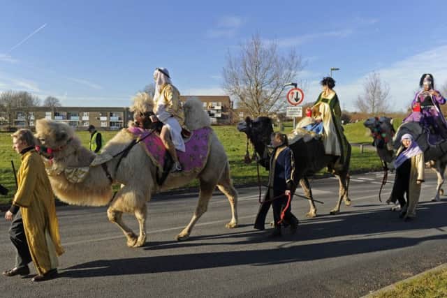The christmas nativity at St Clare's Church in Warren Park played host to a trio of real camels  Picture Ian Hargreaves  (161351-5)
